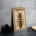 a sign with a picture of a termite, indicating the presence of termites in the area.