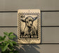 a sign with a goat's head and the text "GOAT KID" on it, mounted on a wall.