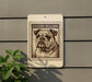 a sign with a picture of a bulldog, mounted on a wall.