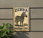 a sign with a zebra illustration and the text "Zebra 60c Mountain Zebra".
