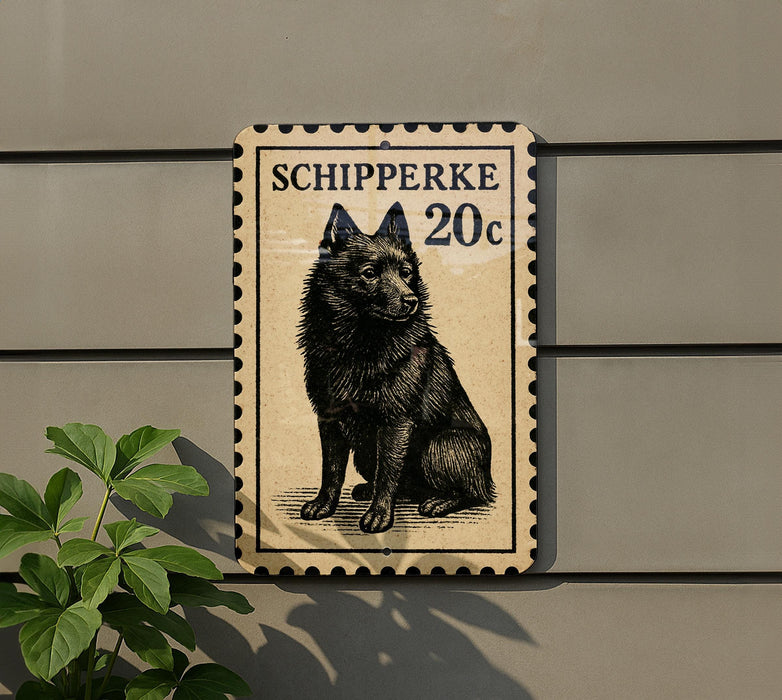 a black dog sitting on a beige background, which appears to be a postage stamp.