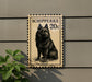 a black dog sitting on a beige background, which appears to be a postage stamp.