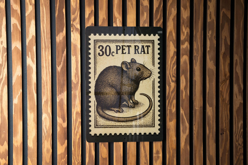 A black and white postage stamp featuring a rat, with the text "30. PET RAT" printed on it.