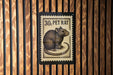 A black and white postage stamp featuring a rat, with the text "30. PET RAT" printed on it.