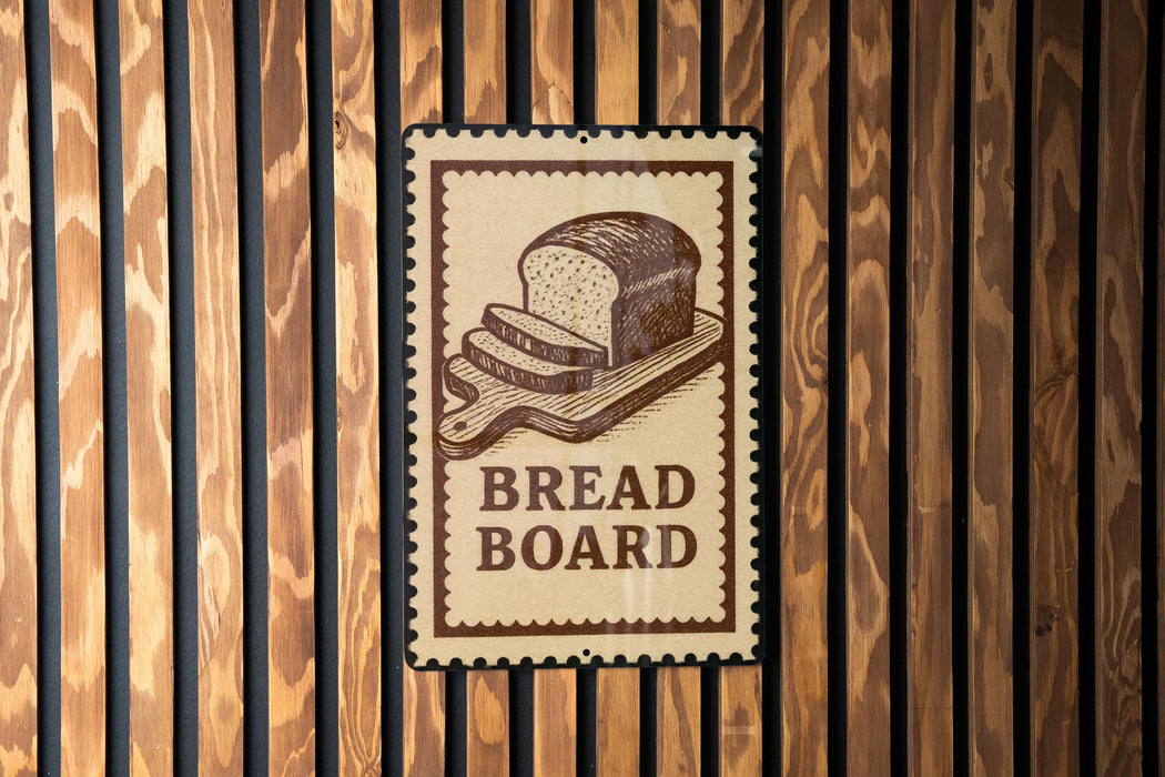 A sign with the word "BREAD BOARD" is displayed on a wooden wall.