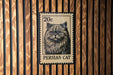 A 20c postage stamp featuring a close-up of a Persian cat.
