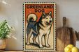 A framed vintage postage stamp depicting a husky dog, with the text "GREENLAND DOG" printed on it.