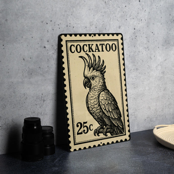 A metal stamp featuring a detailed illustration of a cockatoo, with the text "COCKATOO" and the denomination "25c" printed on it.
