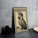 A metal stamp featuring a detailed illustration of a cockatoo, with the text "COCKATOO" and the denomination "25c" printed on it.