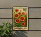 A postage stamp featuring a vibrant image of a flower garden, with the text "GAILLARDIA BED" printed on it.