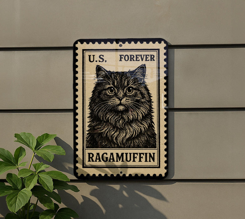 A black and white postage stamp featuring a cat's face, with the text "U.S. Forever Ragamuffin" printed on it.