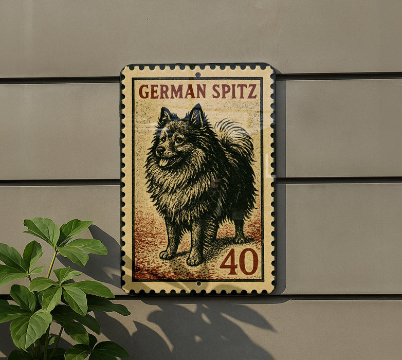 a German Spitz dog, which is a breed of small, long-haired, and curly-haired dog. The dog is depicted in a stamp-like design, with the number 40 visible in the image.