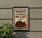 a sign with the text "HOME IS WHERE MY CAT IS" and an illustration of a cat.
