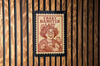A stamp-like sign with the text "Crazy Hamster Lady" and an illustration of an elderly woman holding a hamster.