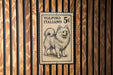 A vintage postage stamp featuring a dog, with the text "VOLPINO ITALIANO 5¢" printed on it.