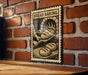A sign with the text "BREAD BAKING" and an illustration of a baker working in a brick oven.