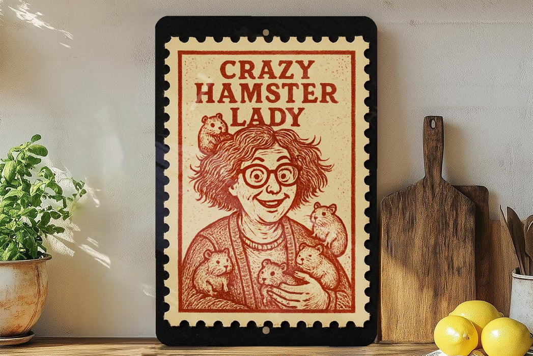 a framed illustration of a woman with a hamster on her lap, accompanied by the text "Crazy Hamster Lady" on a red and white background.