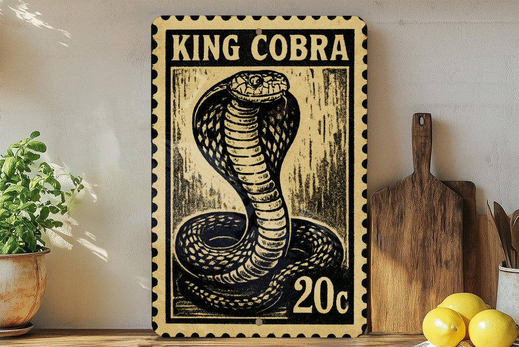 A framed image of a cobra, a type of snake, is displayed on a wall next to a wooden cutting board and some lemons.
