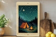 A framed illustration depicting a camping scene with a tent, campfire, and starry night sky.