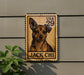 A wooden postcard-style sign featuring a dog's portrait, mounted on a wall next to a plant.