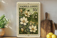 A framed print of a magnolia flower stamp is displayed on a shelf, surrounded by kitchen utensils and a potted plant.