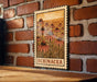 A wooden frame with a printed illustration of flowers on a brick wall.