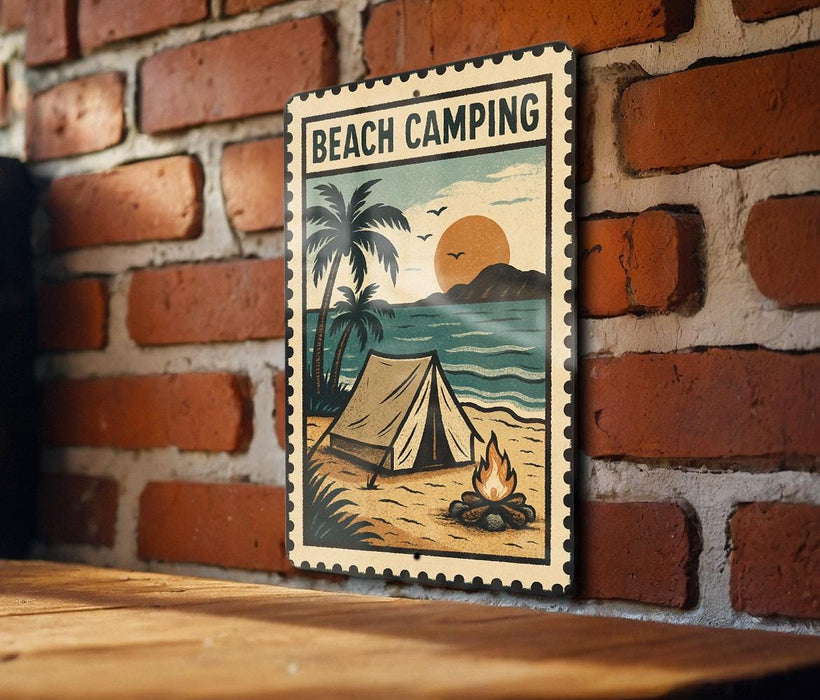 A vintage-style metal sign with a beach camping scene, featuring a tent, palm trees, and a campfire on a sandy beach.