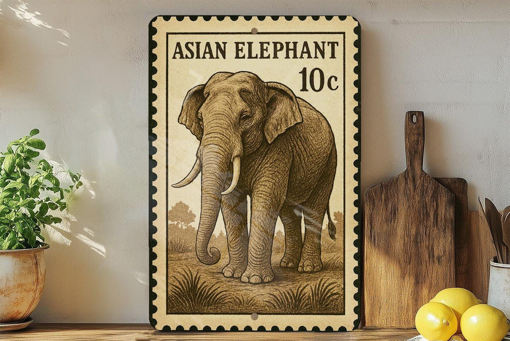 a framed illustration of an elephant, which appears to be a postage stamp-like design. The elephant is depicted in a detailed, realistic style, and the stamp-like border suggests it is a reproduction of a postage stamp. The elephant is standing on a grassy area, and there are some potted plants and kitchen utensils visible in the background.