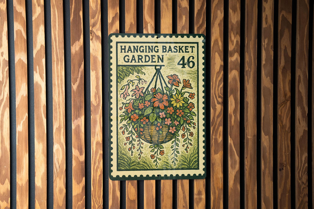 A hanging basket garden sign with the number 46 on it is displayed on a wooden wall.