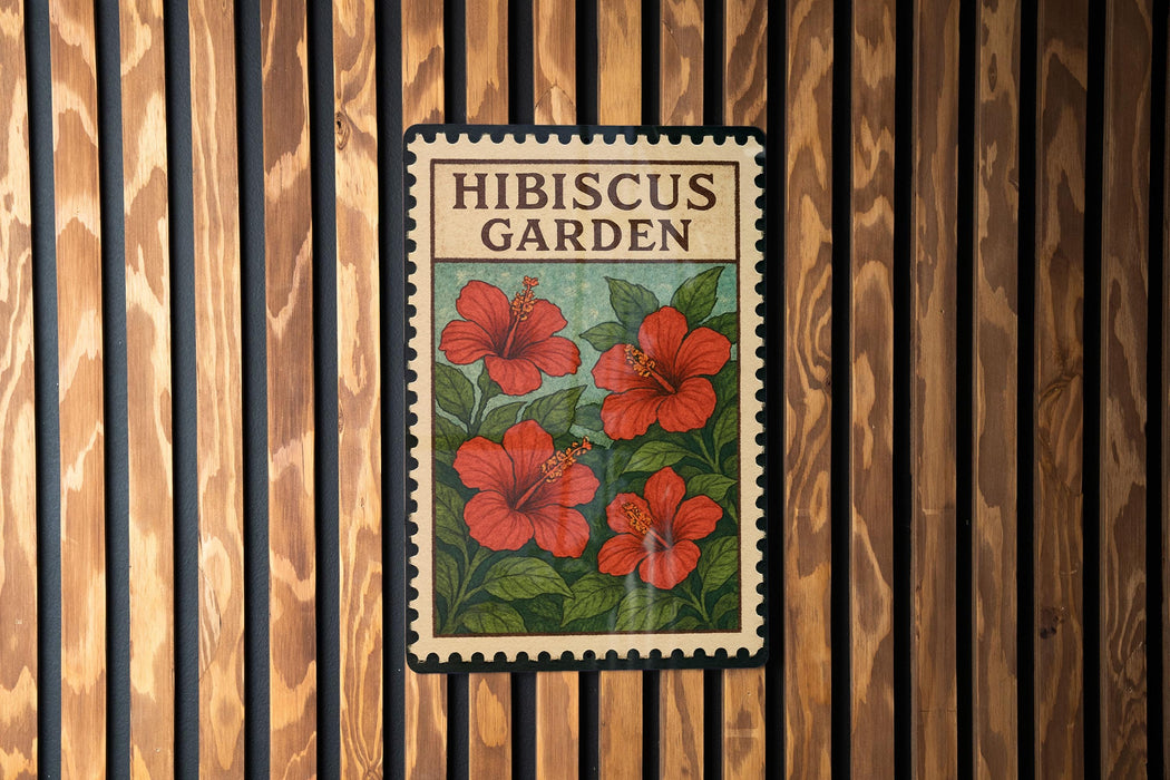 A vintage-style poster or sign for the Hibiscus Garden, featuring a floral illustration of red hibiscus flowers against a green background.