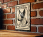 a bull terrier, a small and muscular breed of dog, with a vintage-style metal sign displaying the breed's name and image.