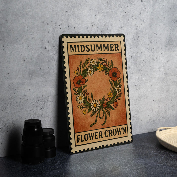 A metal sign with a floral wreath design and the text "MID SUMMER FLOWER CROWN" is displayed on a table.