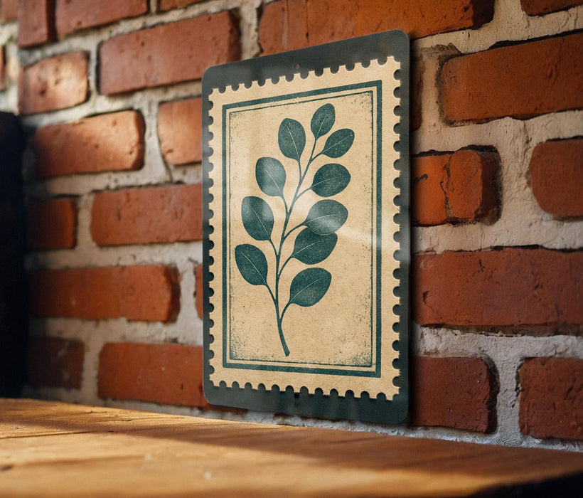a wooden table with a framed print of a leafy plant on the wall behind it.