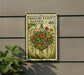A hanging basket garden sign with the number 46 on it, hanging on a wall next to a plant.