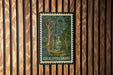 a framed illustration of a forest scene with the text "EUCALYPTUS GROVE" on the frame.