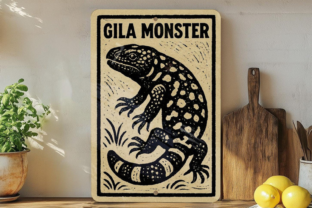 a wooden sign with a black and white illustration of a gila monster, a type of lizard, on a shelf next to a wooden cutting board and some lemons.