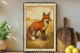 a framed illustration of a fox standing in a grassy field, with a wooden cutting board and a potted plant to the left of the frame.