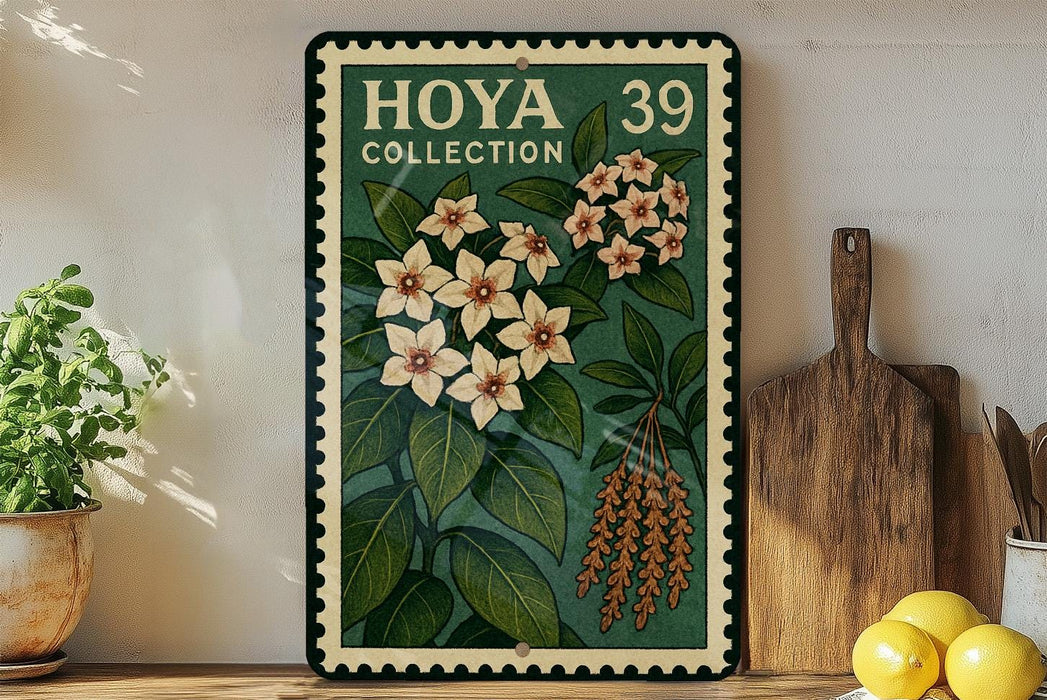 A framed poster of a flower with a green border and a white border, displaying the text "HOYA COLLECTION 39" and an illustration of a flower with green leaves and orange flowers.
