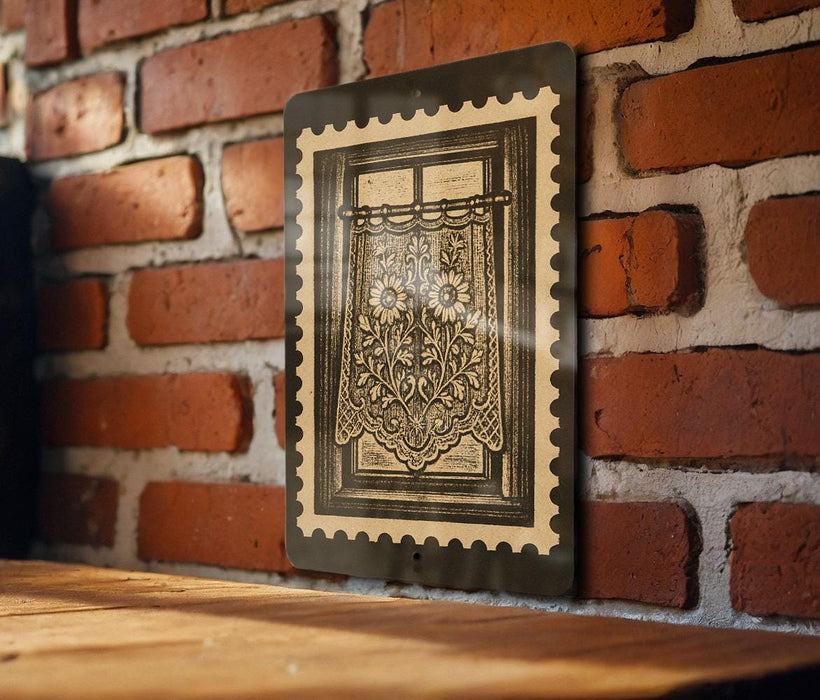 a wooden table with a framed picture of a window with a floral design hanging on the wall behind it.