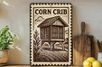 a wooden sign with a picture of a crib, placed on a wooden shelf next to a potted plant and a wooden cutting board.