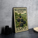 A vintage postage stamp featuring a blackberry patch, placed on a table next to some black camera lenses.