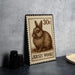 A brown rabbit on a brown and white postage stamp, with the text "30c" and "JERSEY WOOLY" printed on it.