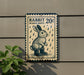 A sign advertising "Rabbit 20¢ in Rain Boots" is displayed on a wall, with a plant visible to the left.