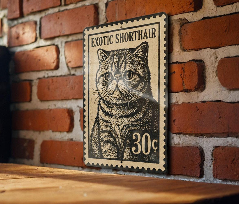 A metal stamp featuring a cat's face is mounted on a brick wall.