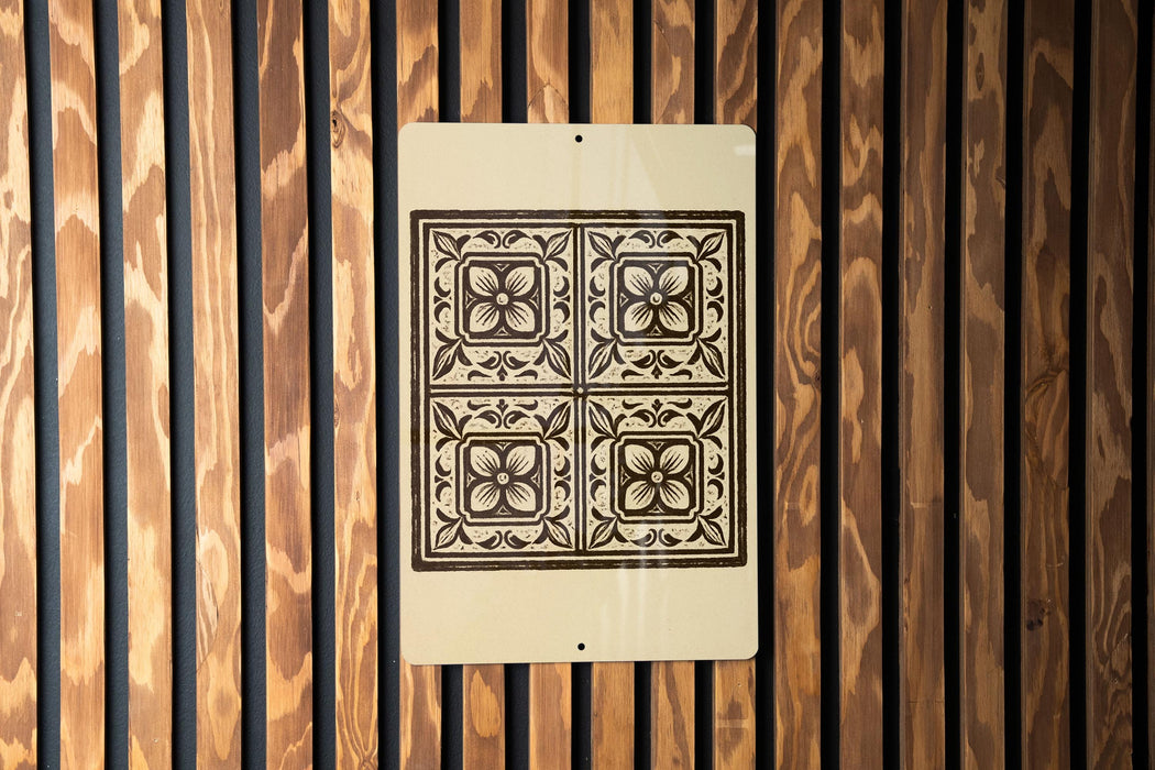 a decorative tile pattern on a wooden wall.