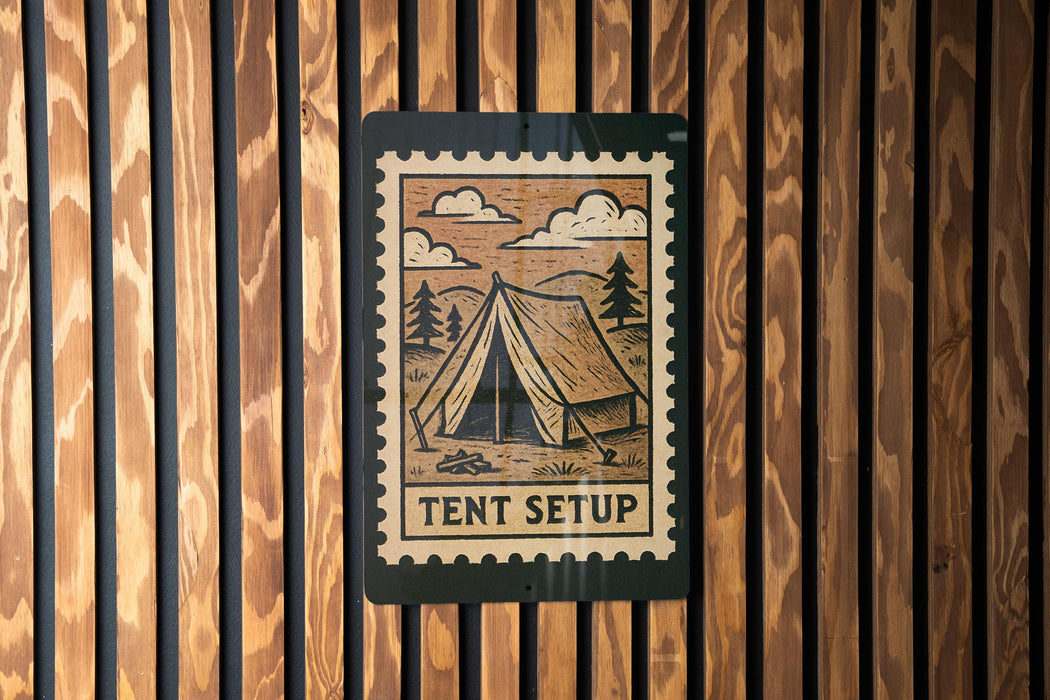 A sign with a tent illustration and the word "TENT SETUP" is mounted on a wooden wall.