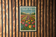 A vintage-style postage stamp depicting a field of colorful tulips, with the text "TULIP FIELD" prominently displayed.