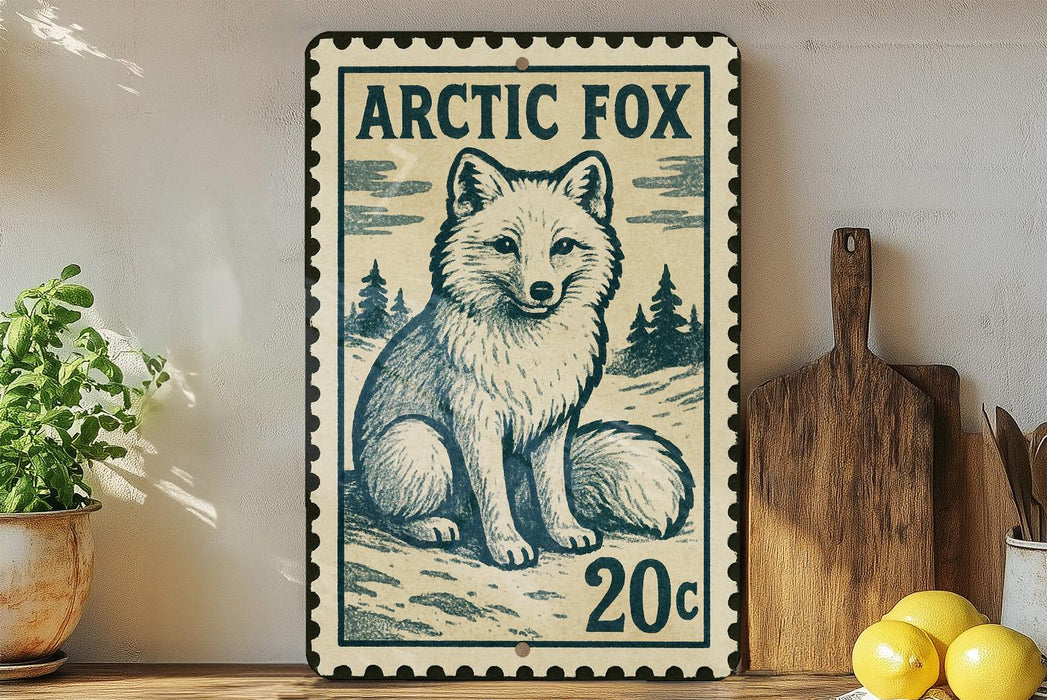 A vintage-style metal stamp depicting an Arctic fox, with the text "ARCTIC FOX" and "20c" printed on it. The stamp is placed on a wooden surface, with a potted plant, a wooden cutting board, and some lemons nearby.