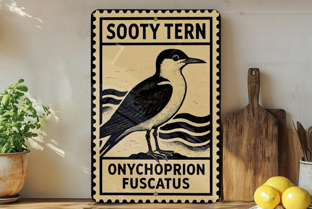A vintage-style metal sign with a black and white illustration of a bird, labeled "Sooty Tern" and "Onychophron Fuscatus", is displayed on a wooden shelf next to a potted plant and a cutting board.