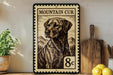 A framed image of a dog, likely a Labrador Retriever, is displayed on a shelf next to a wooden cutting board and some lemons.